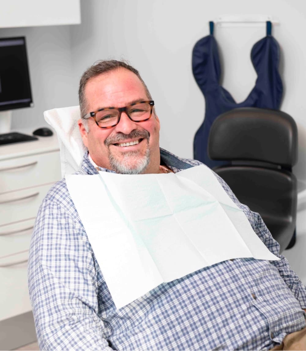 man smiling during dental visit